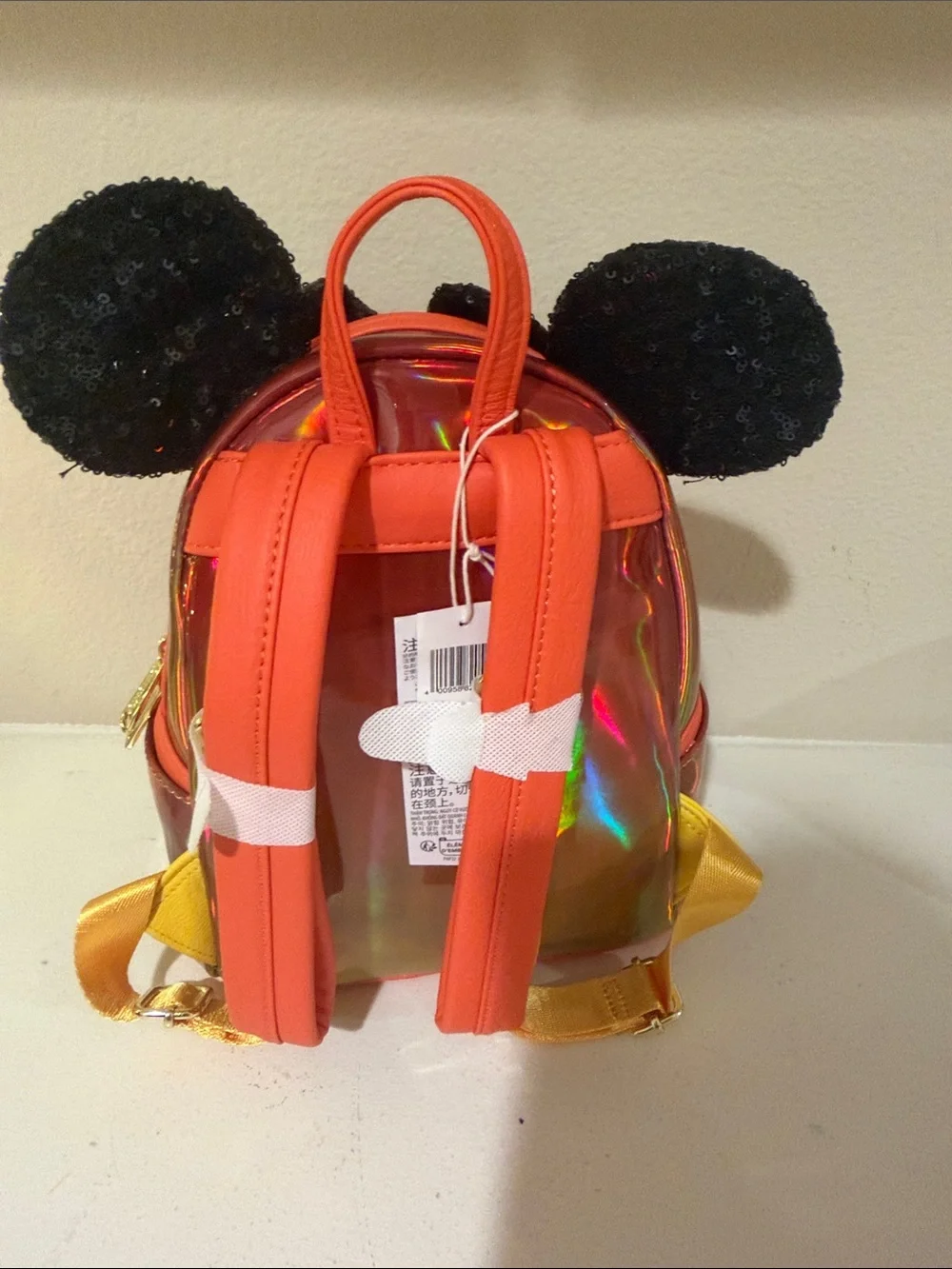 Loungefly Kids Iridescent Orange Mini Backpack with Black Sequin Bow & Ears